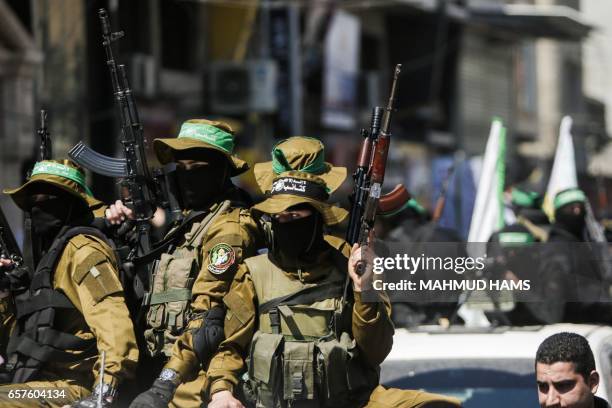 Graphic content / Members of the Ezzedine al-Qassam Brigades, the military wing of the Palestinian Islamist movement Hamas attend the funeral of...