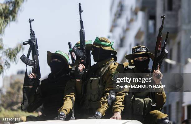 Graphic content / Members of the Ezzedine al-Qassam Brigades, the military wing of the Palestinian Islamist movement Hamas attend the funeral of...