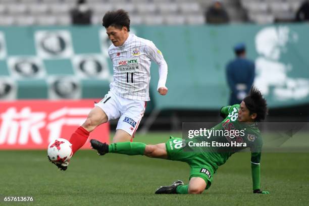 Kyogo Furuhashi of FC Gifu and Ryota Kajikawa of Tokyo Verdy compete for the ball during the J.League J2 match between Tokyo Verdy and FC Gifu at...