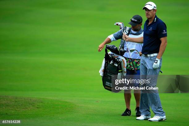 Greg Owen of England pulls a club from his bag on the 18th hole during the second round of the Puerto Rico Open at Coco Beach on March 25, 2017 in...