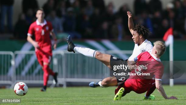 Etienne Amenyido of Germany is challenged by Dominik Dinga of Serbia during the UEFA Elite Round match between U19 Germany and U19 Serbia at...
