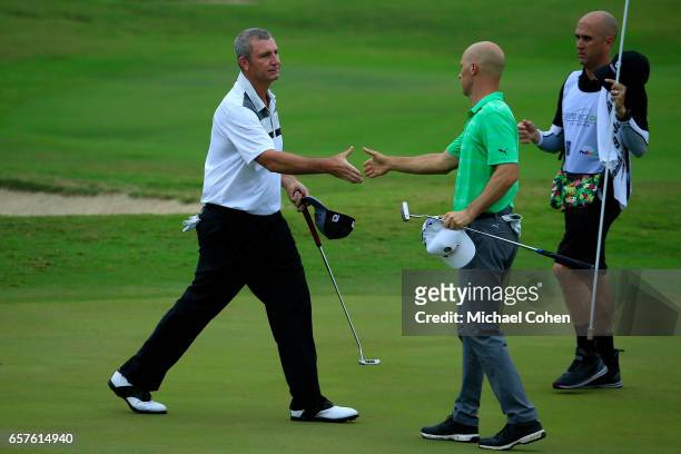 Bill Lunde shakes hands with Ben Crane after their second round at the Puerto Rico Open at Coco Beach on March 25, 2017 in Rio Grande, Puerto Rico....