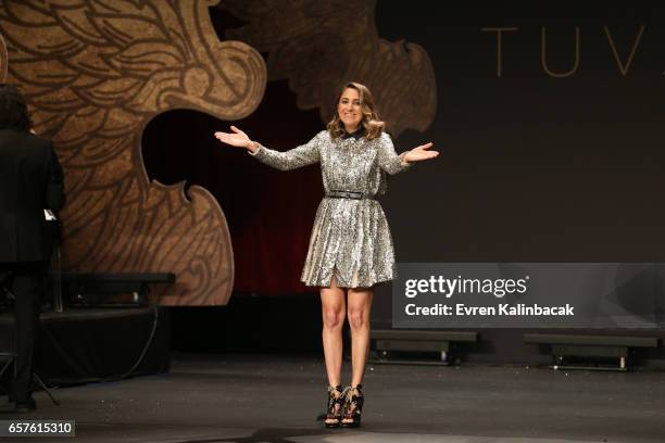 Designer Tuvana Demir acknowledges the applause of the audience after the Tuvanam show during Mercedes-Benz Istanbul Fashion Week March 2017 at Grand...