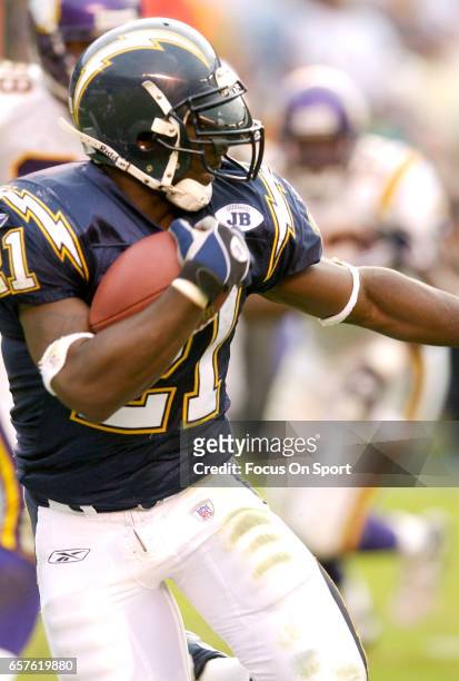 LaDainian Tomlinson of the San Diego Chargers carries the ball against the Minnesota Vikings during an NFL Football game November 9, 2003 at Jack...