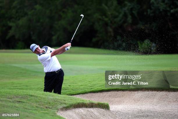 Bill Lunde plays his second shot from a fairway bunker on the 18th hole during the second round of the Puerto Rico Open at Coco Beach on March 25,...