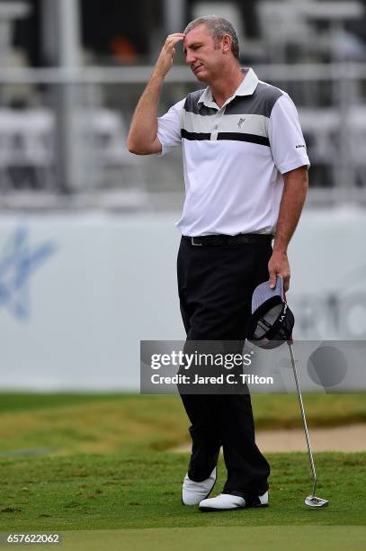 Bill Lunde pauses for a moment on the 18th green during the second round of the Puerto Rico Open at Coco Beach on March 25, 2017 in Rio Grande,...