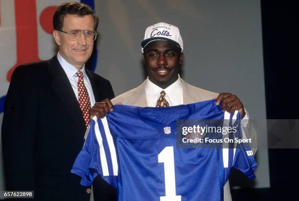 Commissioner Paul Tagliabue stands with Marshall Faulk the number 1 draft pick of the Indianapolis Colts in the 1994 NFL draft April 24, 1994 at the...