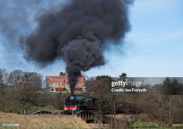 The steam locomotive Royal Scot under steam between Grosmont and Pickering on the North Yorkshire Moors Railway on March 25, 2017 in Grosmont, United...