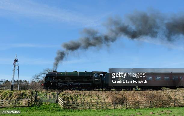 The steam locomotive Royal Scot under steam between Grosmont and Pickering on the North Yorkshire Moors Railway on March 25, 2017 in Grosmont, United...