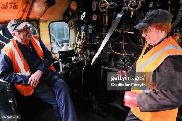 Support crew volunteers Diana Hurfurt and John Blair chat as they stand on the footplate of the steam locomotive Royal Scot in Grosmont engine sheds...