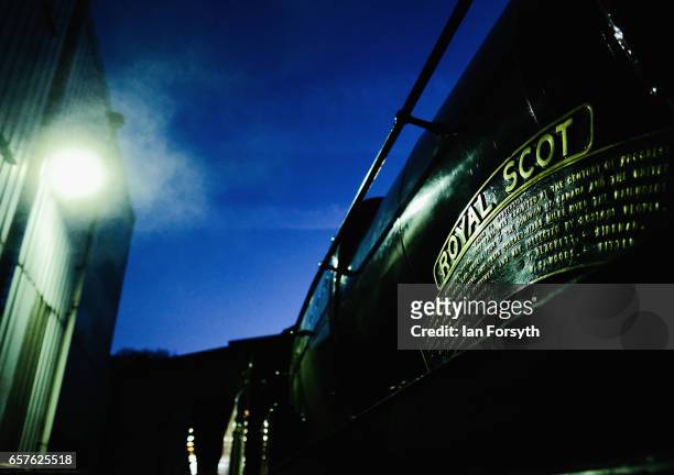 Close-up of the name plate of the steam locomotive Royal Scot as it is prepared in during the early hours in Grosmont engine sheds ahead of running...