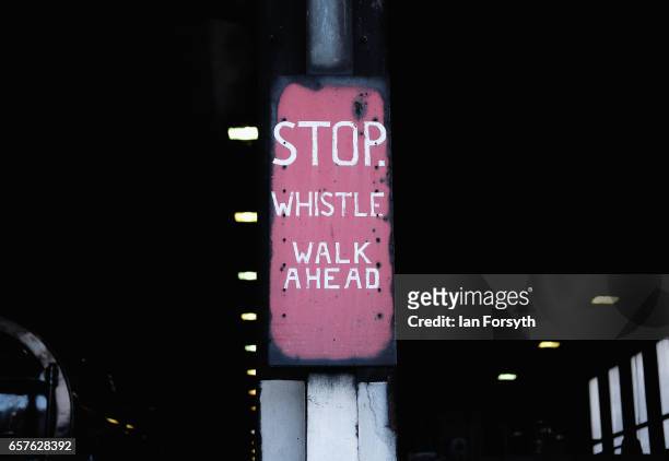 Sign hangs from a post as the steam locomotive Royal Scot is prepared in Grosmont engine sheds ahead of running between Grosmont and Pickering on the...