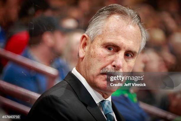 Head coach Willie Desjardins of the Vancouver Canucks looks on from the bench during their NHL game against the Detroit Red Wings at Rogers Arena...