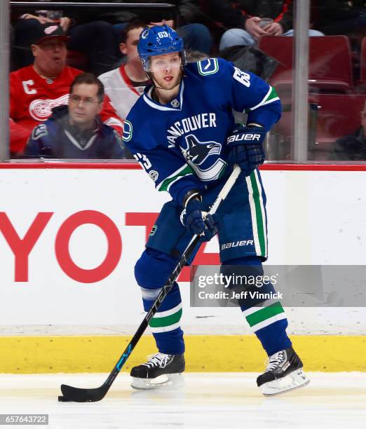 Philip Larsen of the Vancouver Canucks skates up ice with the puck during their NHL game against the Detroit Red Wings at Rogers Arena February 28,...