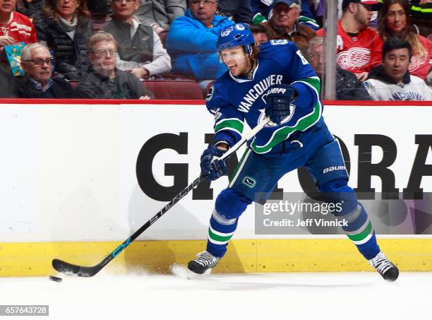 Philip Larsen of the Vancouver Canucks skates up ice with the puck during their NHL game against the Detroit Red Wings at Rogers Arena February 28,...