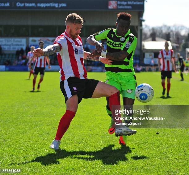 Lincoln City's Alan Power vies for possession with Forest Green Rovers' Drissa Traore during the Vanarama National League match between Lincoln City...
