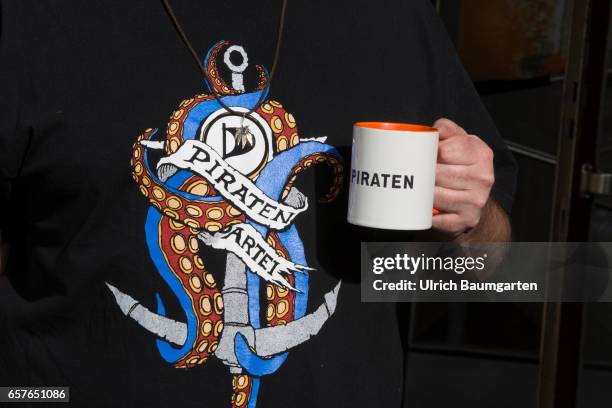 Federal Party Conference of the Pirate Party in Duesseldorf. Pirate Party T-Shirt and a coffee pot with the inscription Pirates.