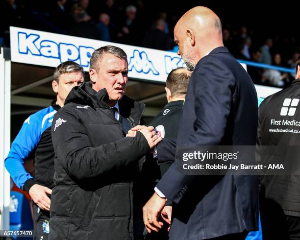 Lee Clark head coach / manager of Bury and Uwe Rosler head coach / manager of Fleetwood Town during the Sky Bet League One match between Bury and...