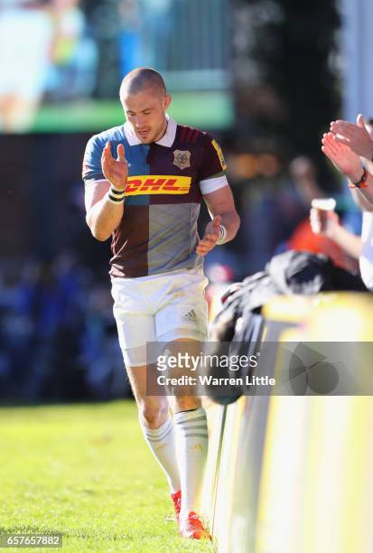 Mike Brown of Harlequins celebrates scoring a try during the Aviva Premiership match between Harlequins and Newcastle Falcons at Twickenham Stoop on...