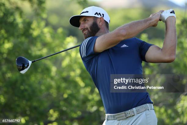 Dustin Johnson tees off on the 7th hole of his match during round four of the World Golf Championships-Dell Technologies Match Play at the Austin...