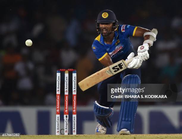 Sri Lankan cricketer Dinesh Chandimal plays a shot during the first one day international cricket match between Sri Lanka and Bangladesh at The...