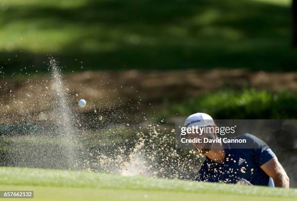 Dustin Johnson of the United States plays his second shot on the par 3, seventh hole in his match against Zach Johnson during the fourth round of the...