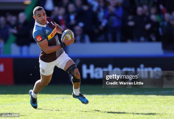 Joe Marchant of Harlequins scores an interception try during the Aviva Premiership match between Harlequins and Newcastle Falcons at Twickenham Stoop...