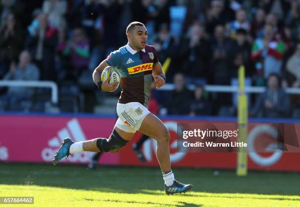 Joe Marchant of Harlequins scores an interception try during the Aviva Premiership match between Harlequins and Newcastle Falcons at Twickenham Stoop...