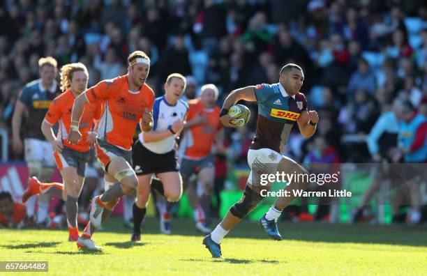 Joe Marchant of Harlequins scores an interception try during the Aviva Premiership match between Harlequins and Newcastle Falcons at Twickenham Stoop...