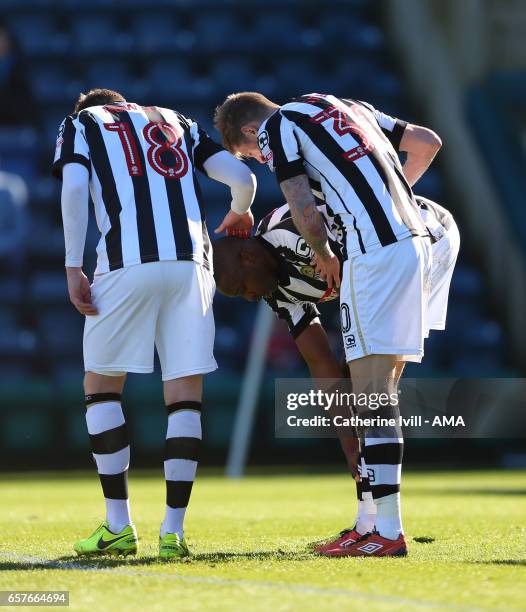 Shola Ameobi of Notts County is congratulated by his team mates after he scores to make it 0-1 during the Sky Bet League Two match between Wycombe...