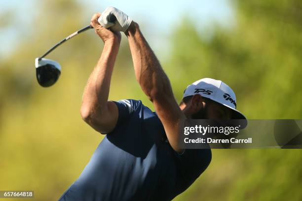 Dustin Johnson tees off on the 8th hole of his match during round four of the World Golf Championships-Dell Technologies Match Play at the Austin...