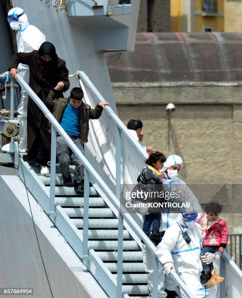 Immigrants are disembarked in Naples from rescue ship Scirocco Pilot after being saved in Mediterranean sea.