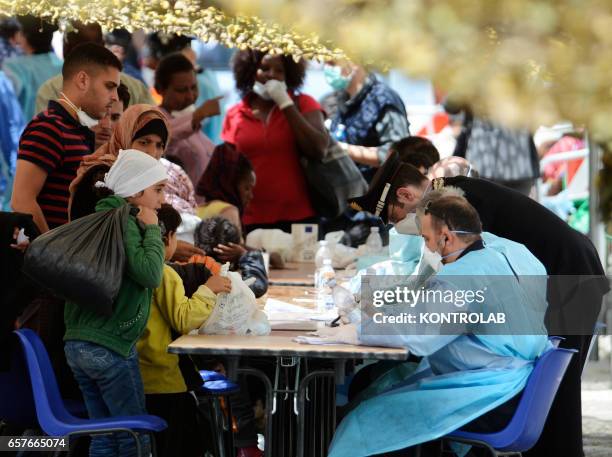 Immigrants are disembarked in Naples from rescue ship Scirocco Pilot after being saved in Mediterranean sea.