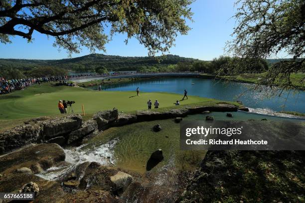 Phil Mickelson and Marc Leishman of Australia walk on the 11th green of their match during round four of the World Golf Championships-Dell...