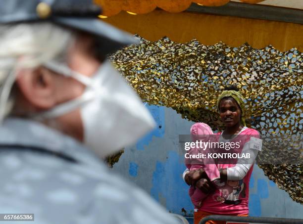 Immigrants are disembarked in Naples from rescue ship Scirocco Pilot after being saved in Mediterranean sea.