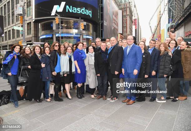 Fashion designer Carmen Marc Valvo and The Colon Cancer Alliance pose outside NASDAQ after ringing the Nasdaq Stock Market Opening Bell at NASDAQ on...