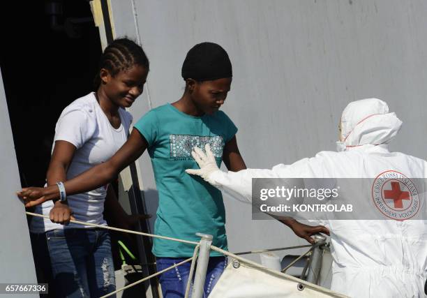 Immigrants are disembarked in Naples from rescue ship Scirocco Pilot after being saved in Mediterranean sea.