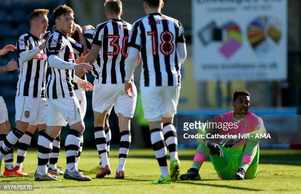 Jamal Blackman of Wycombe Wanderers sits dejected as Notts County celebrate after Shola Ameobi of Notts County scores to make it 0-1 during the Sky...
