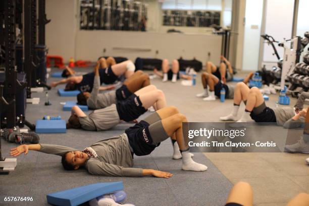 Gabby Williams, , with team mates during warm down and stretching under the supervision of strength coach Amanda Kimball during the The UConn Huskies...