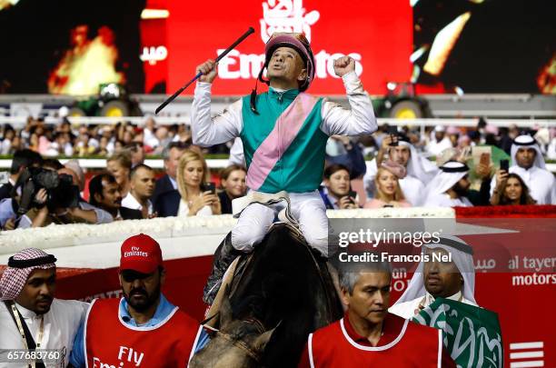 Mike Smith riding Arrogate celebrates winning the Dubai World Cup Sponsored By Emirates Airline during the Dubai World Cup at the Meydan Racecourse...