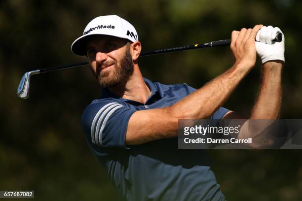 Dustin Johnson tees off on the 10th hole of his match during round four of the World Golf Championships-Dell Technologies Match Play at the Austin...