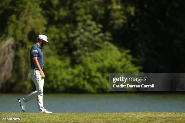 Dustin Johnson walks on the 14th hole of his match during round four of the World Golf Championships-Dell Technologies Match Play at the Austin...