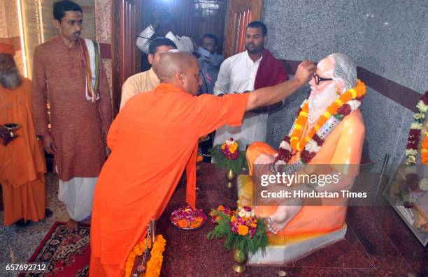 Chief Minister of Uttar Pradesh and Mahant of Gorakhdham Temple Yogi Adityanath performing puja of Brammhlin Guru Awaidhnath at Gorakhnath Temple on...