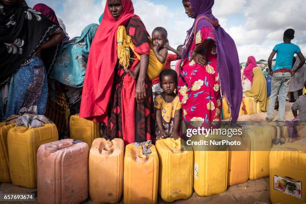 Women waiting to fill ferrycans with water at kiosk renowated by Polish Humanitarian Action. Somalia in the grip of an unprecedent and devastating...