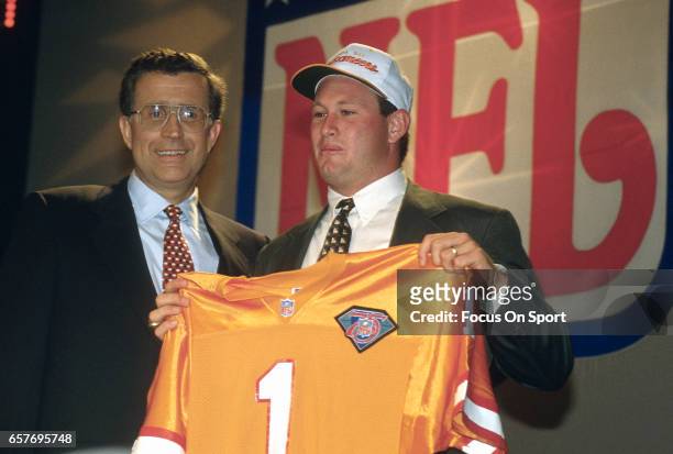 Commissioner Paul Tagliabue stands with Trent Dilfer the number 1 draft pick of the Tampa Bay Buccaneers in the 1994 NFL draft April 24, 1994 at the...
