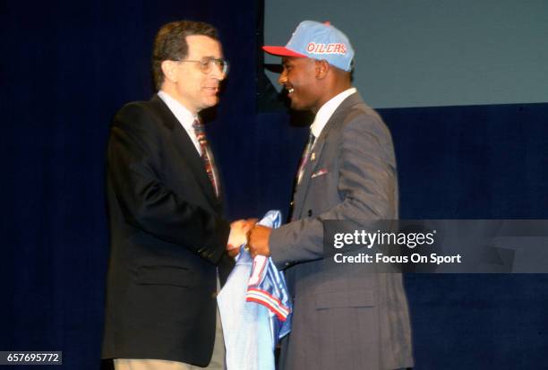 Commissioner Paul Tagliabue shakes hands with Steve McNair the number 1 draft pick of the Houston Oilers in the 1995 NFL draft April 22, 1995 at...