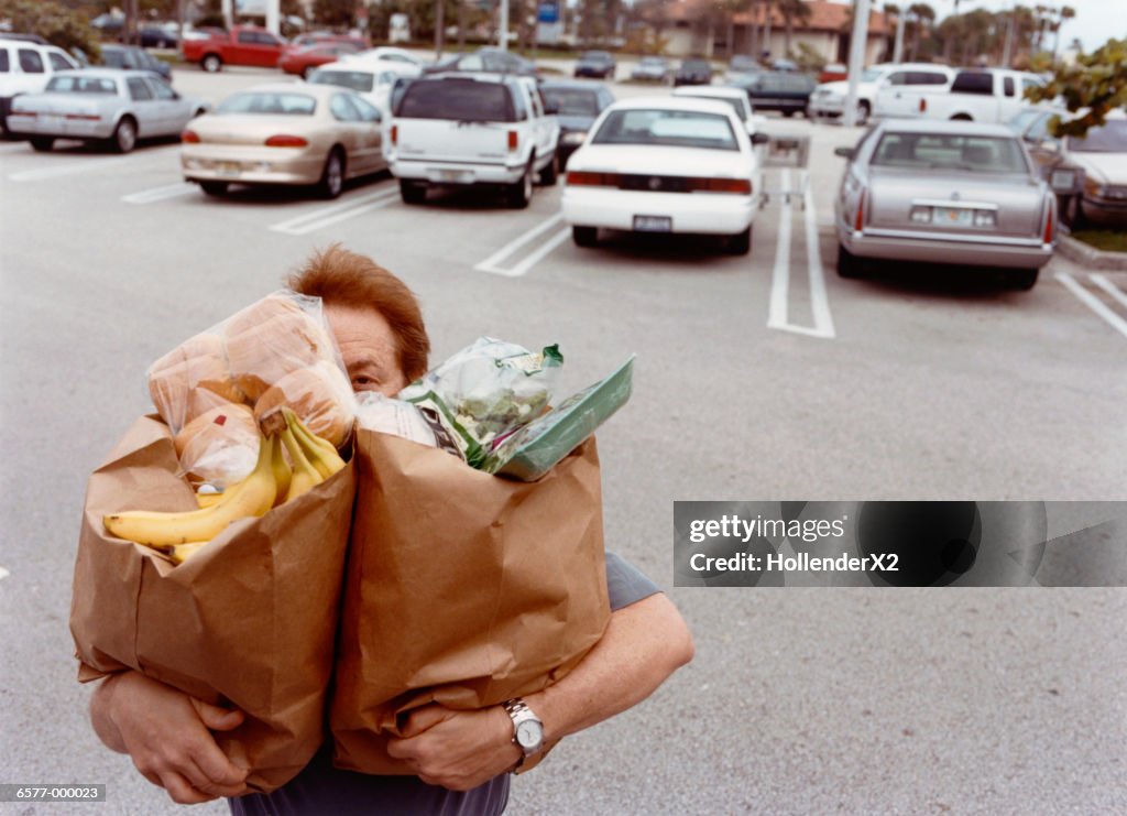 Man Carrying Grocery Bags