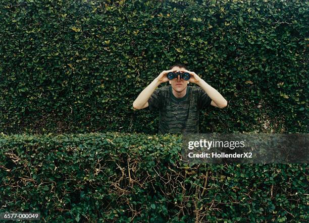 man using binoculars - scout stock pictures, royalty-free photos & images