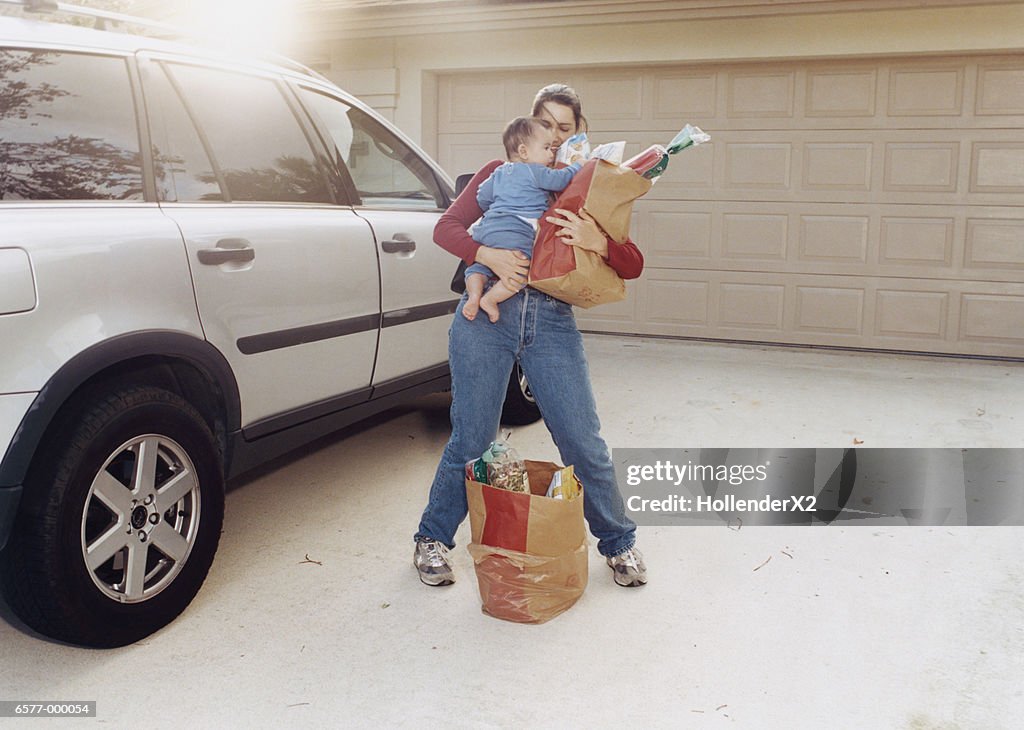 Woman with Baby and Groceries