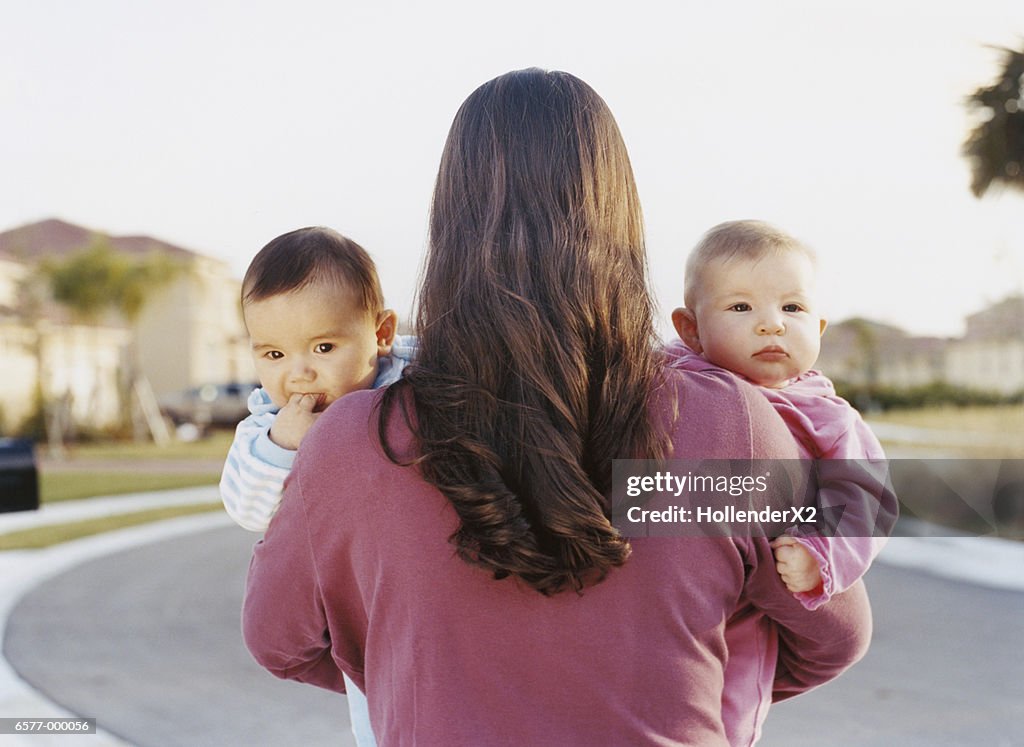 Woman Holding Babies